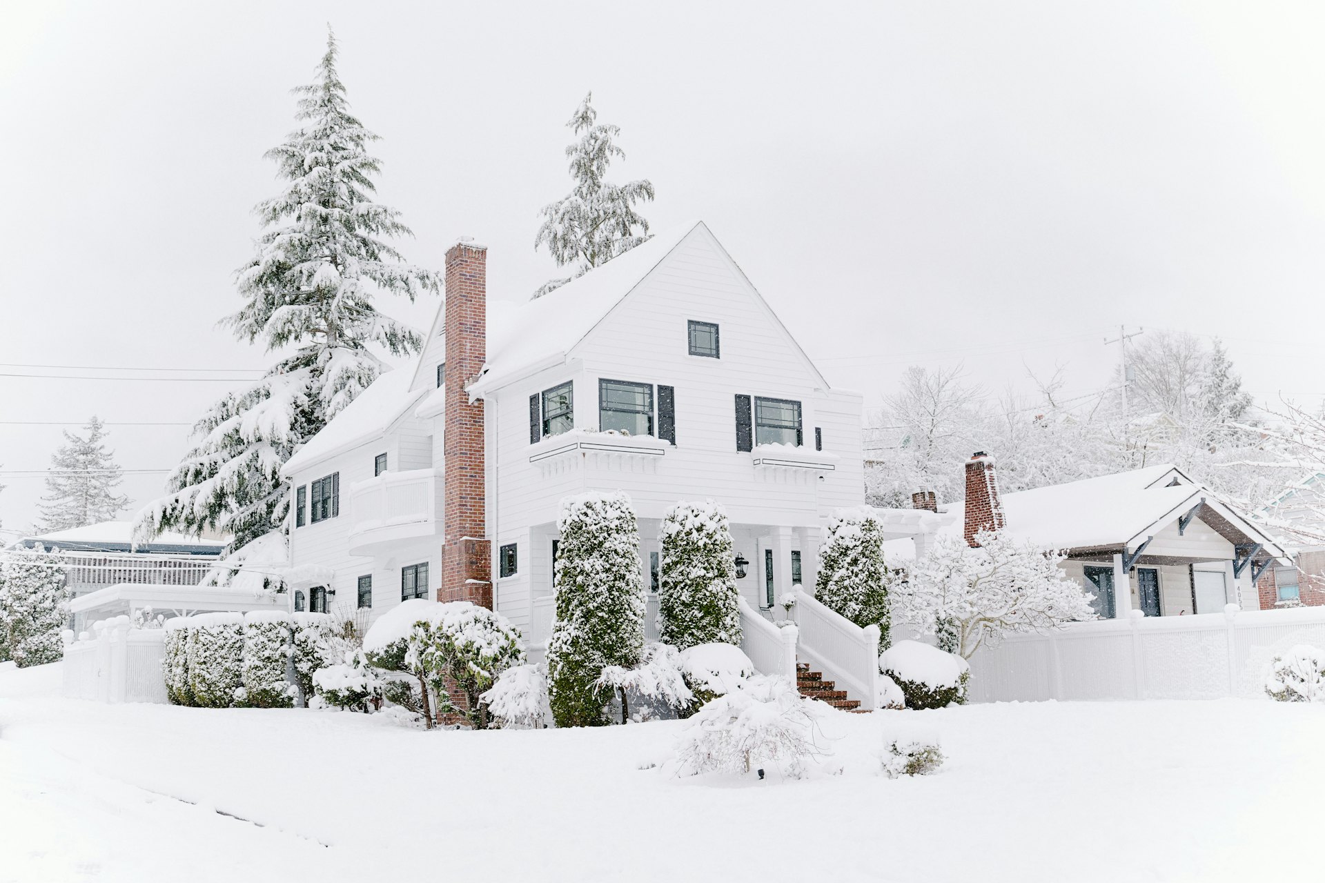 Houses covered in snow after a storm in Ramsey, Minnesota