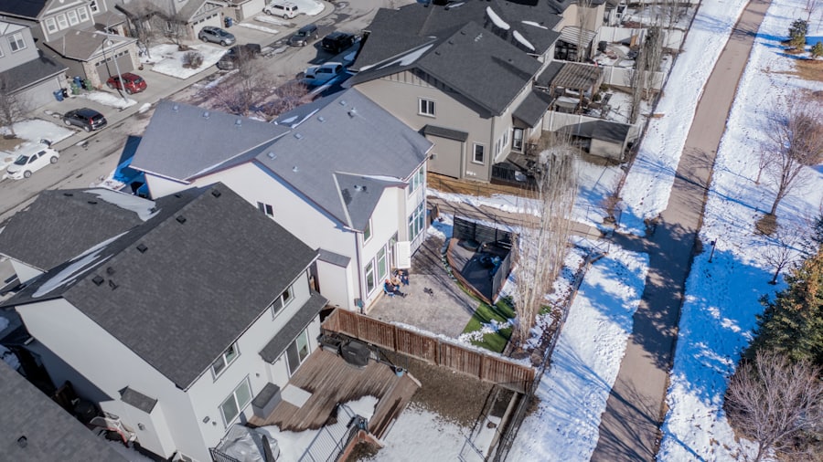 Suburban street in Ramsey, Minnesota with snow melting off the lawns